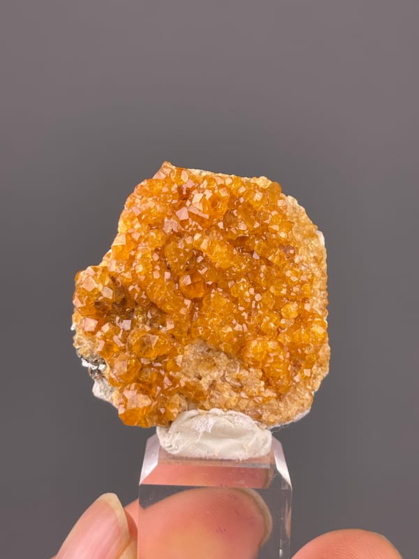 Spessartine Garnet specimen from Yunxiao, Fujian, China featuring orange-brown crystal druse