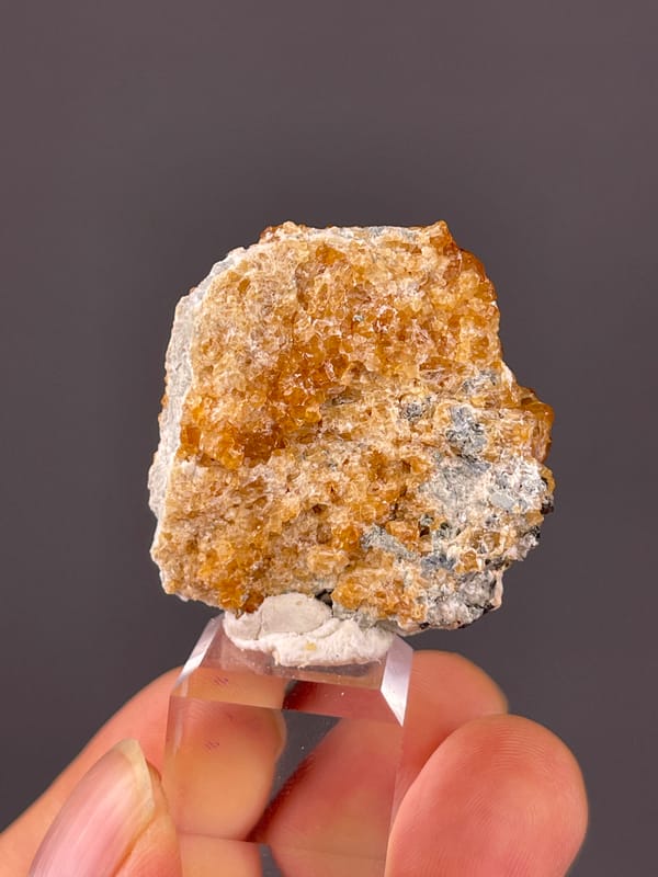 Spessartine Garnet specimen from Yunxiao, Fujian, China presenting orange-brown crystal druse