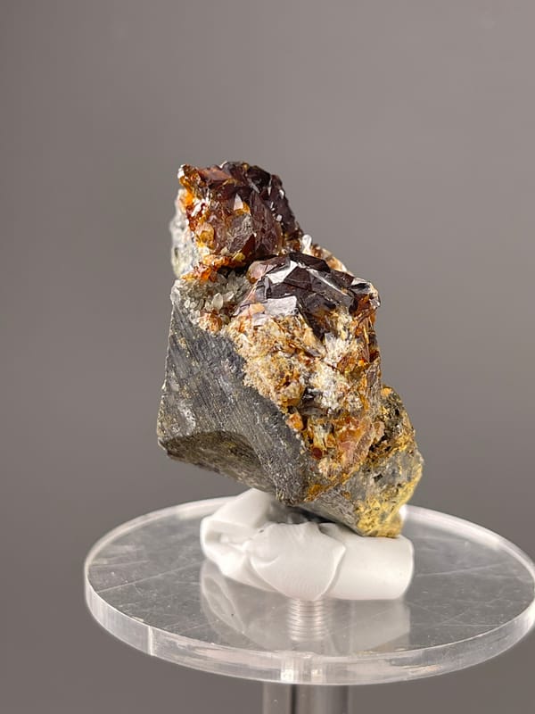Reddish-brown resinous crystals visible on sphalerite specimen from Hunan, China