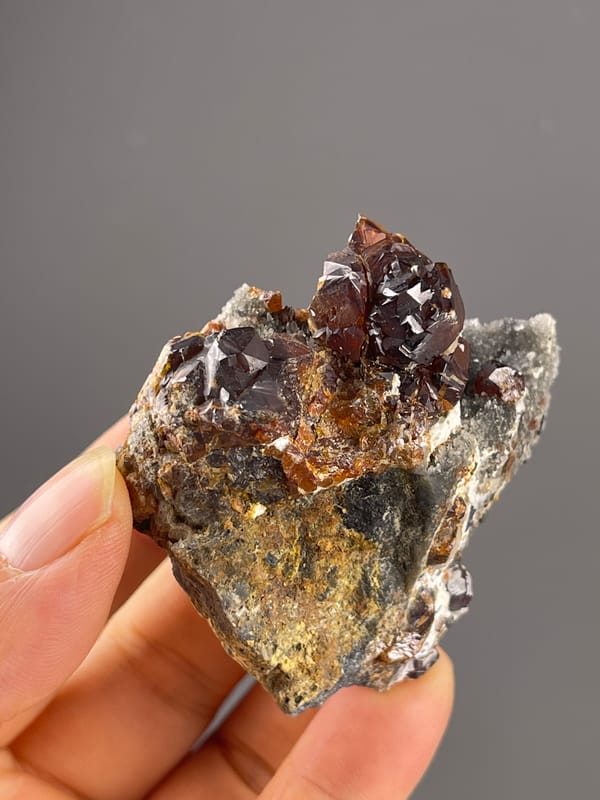 Sphalerite specimen from Hunan, China highlighting reddish-brown resinous crystals