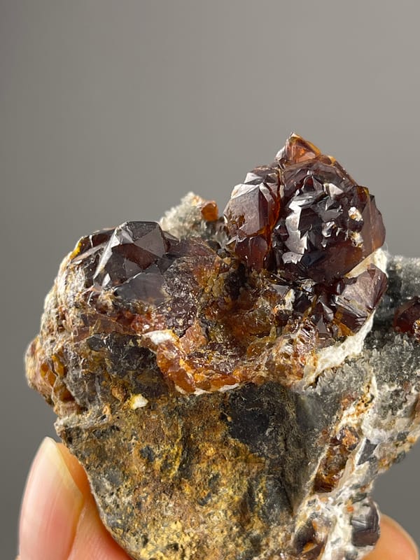 Sphalerite specimen from Hunan, China bearing reddish-brown resinous crystals