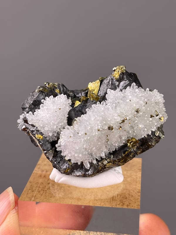 Sphalerite specimen from Jiangxi, China showing white quartz on dark sulfide matrix