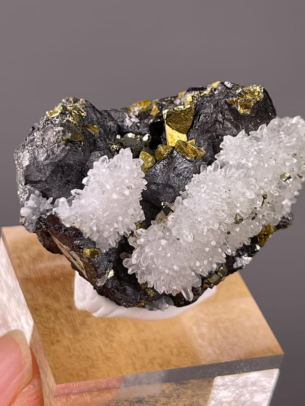White quartz on dark sulfide matrix on natural sphalerite specimen from Jiangxi, China