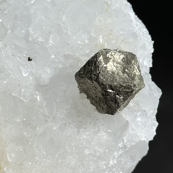 Three ball-shaped pyrite crystals on white quartz plate from Guangxi, China, view 12 of 12