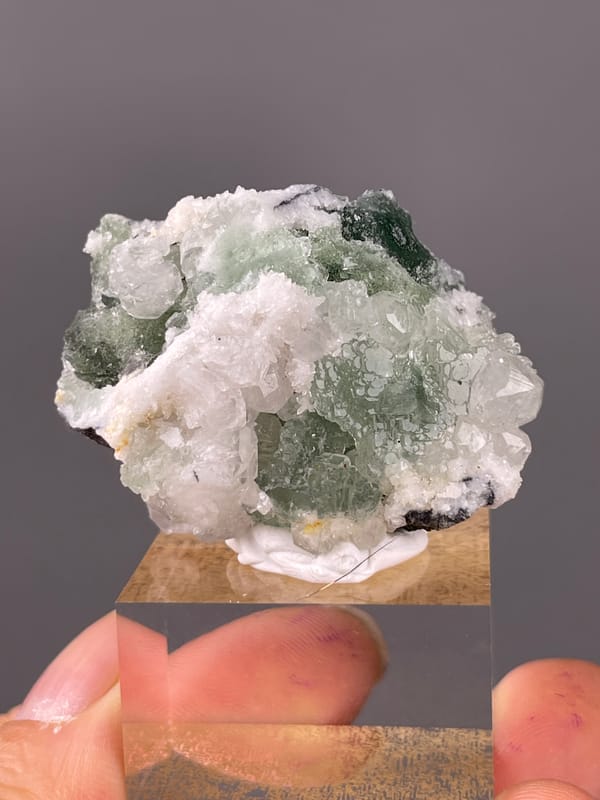 Stepped Fluorite specimen from Fujian, China featuring translucent green fluorite with white druse