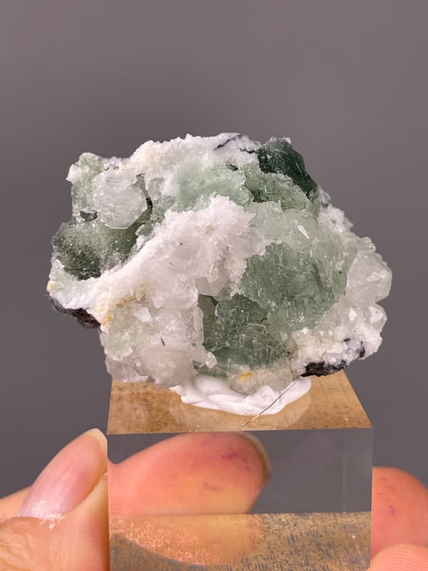 Stepped Fluorite specimen from Fujian, China presenting translucent green fluorite with white druse