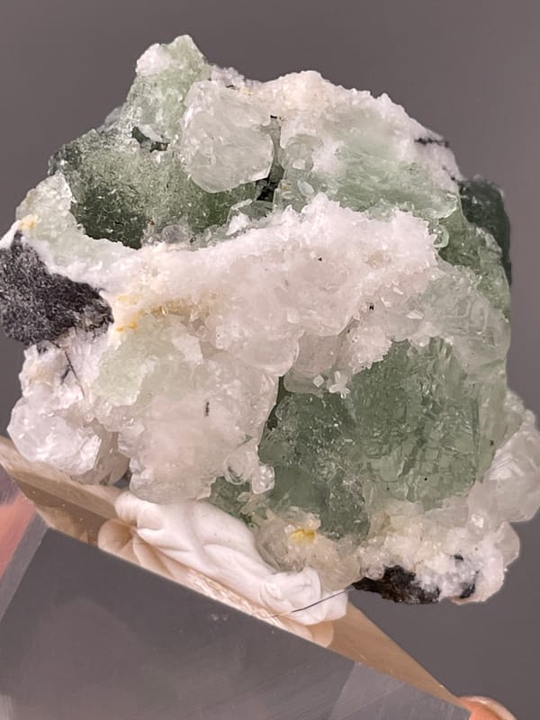 Stepped Fluorite specimen from Fujian, China displaying translucent green fluorite with white druse