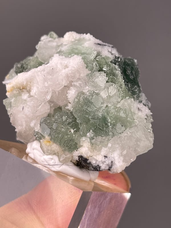 Stepped Fluorite specimen from Fujian, China highlighting translucent green fluorite with white druse
