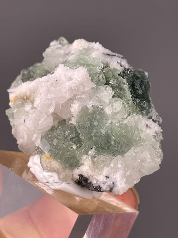 Stepped Fluorite specimen from Fujian, China, characterized by translucent green fluorite with white druse