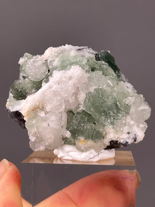 Stepped Fluorite specimen from Fujian, China bearing translucent green fluorite with white druse