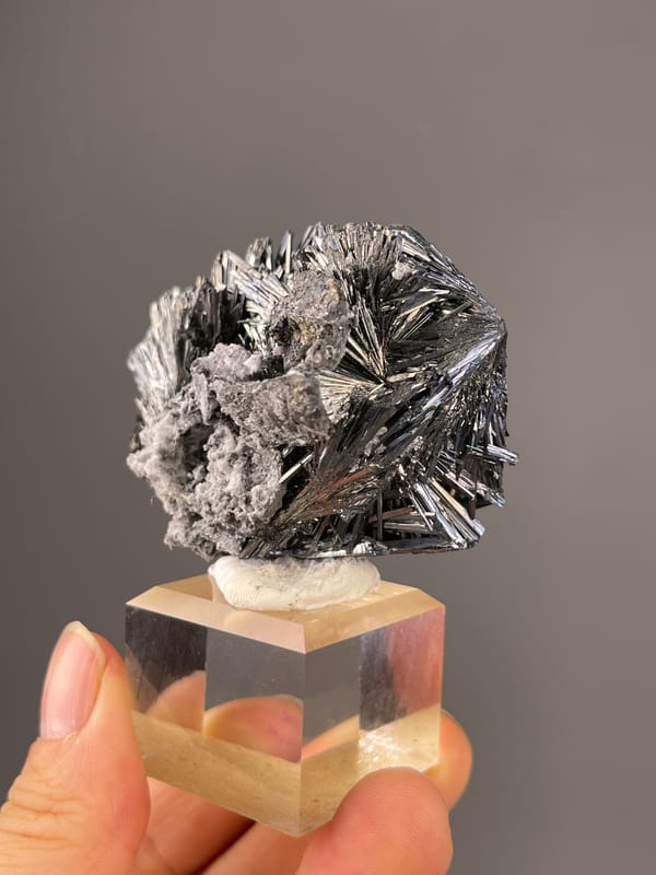 Stibnite specimen from Bulgaria displaying steel-gray radiating metallic needles