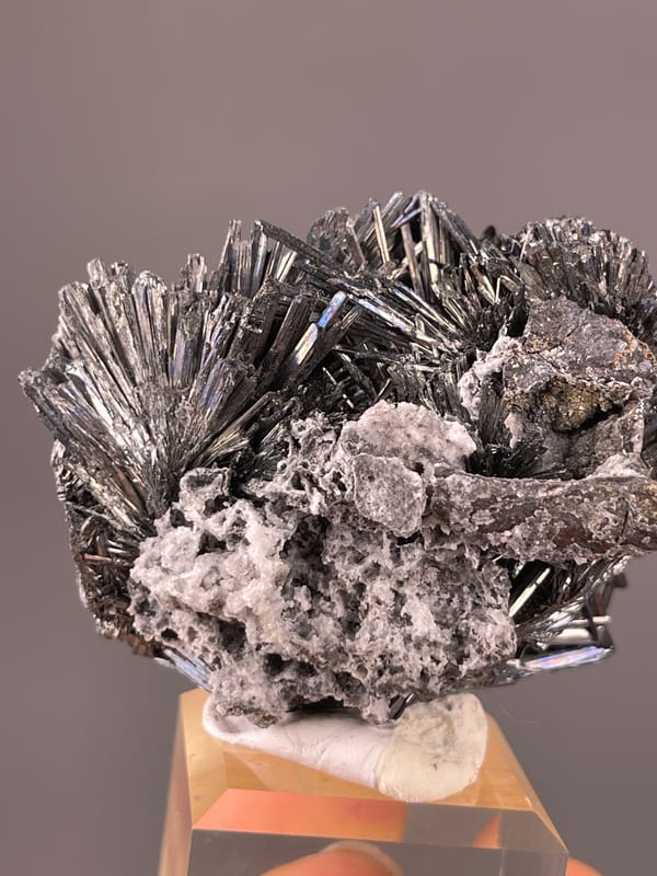 Stibnite specimen from Bulgaria bearing steel-gray radiating metallic needles
