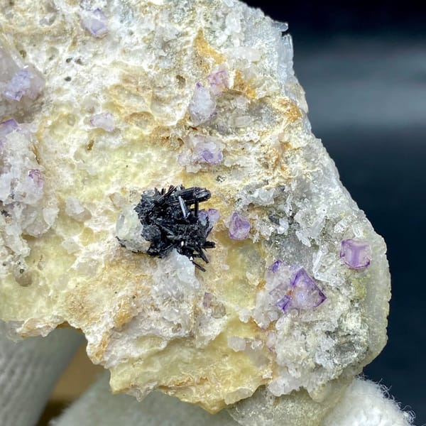Grey stibnite blades with purple fluorite on pale matrix from Shangbao, Hunan, China, view 4 of 9