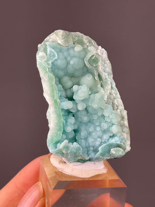Strontianite specimen from Yunnan, China, defined by pale blue botryoidal spheres