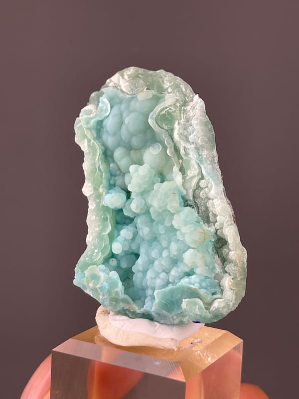Strontianite specimen from Yunnan, China presenting pale blue botryoidal spheres