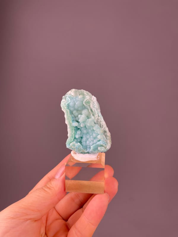 Pale blue botryoidal spheres visible on strontianite specimen from Yunnan, China