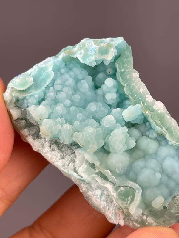 Strontianite specimen from Yunnan, China, characterized by pale blue botryoidal spheres