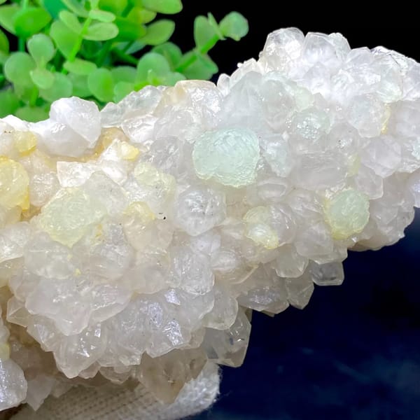 Tall white quartz cluster with pale green prehnite balls from Sichuan, China, view 7 of 9