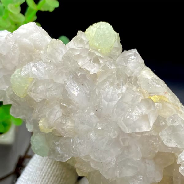 Tall white quartz cluster with pale green prehnite balls from Sichuan, China, view 8 of 9