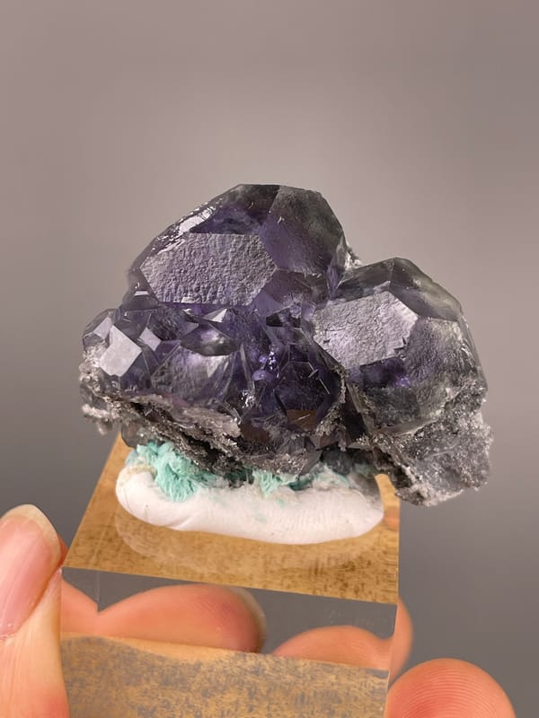 Tanzanite-blue Fluorite specimen from Yongchun, Fujian, China featuring dark purple fluorite with green patch