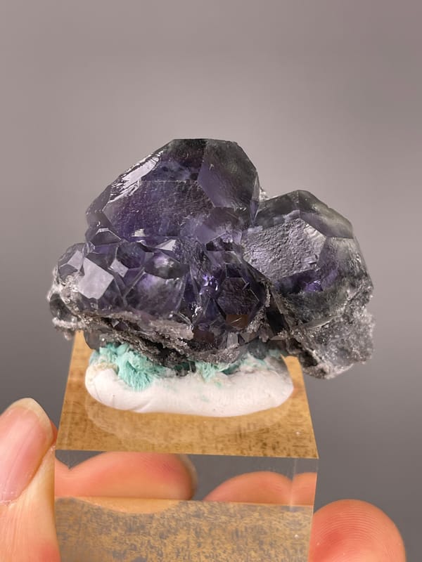 Tanzanite-blue Fluorite specimen from Yongchun, Fujian, China showing dark purple fluorite with green patch