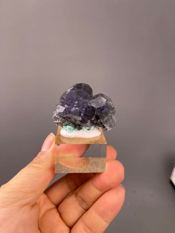 Dark purple fluorite with green patch on natural tanzanite-blue fluorite specimen from Yongchun, Fujian, China