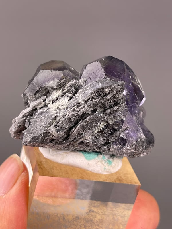 Tanzanite-blue Fluorite specimen from Yongchun, Fujian, China highlighting dark purple fluorite with green patch