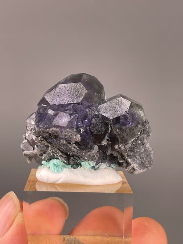 Tanzanite-blue Fluorite specimen from Yongchun, Fujian, China showcasing dark purple fluorite with green patch