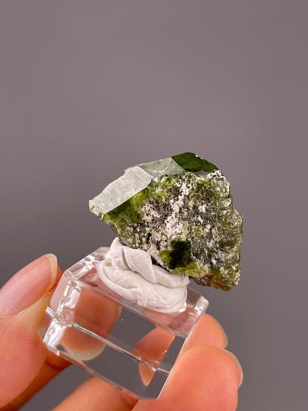 Tourmaline from Brazil: top angle showing a broad pale reflection and green upper face.