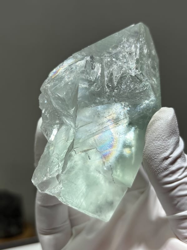 Transparent pale fluorite with rainbow flash from Xuebaoding, Sichuan, China, reverse side