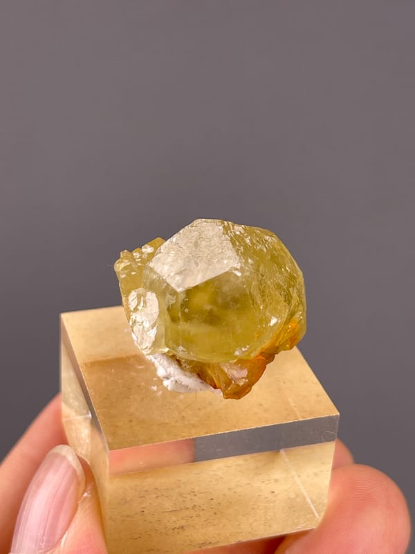 Unidentified specimen from Daye, Hubei, China: oblique view showing yellow transparency around a broad reflection.