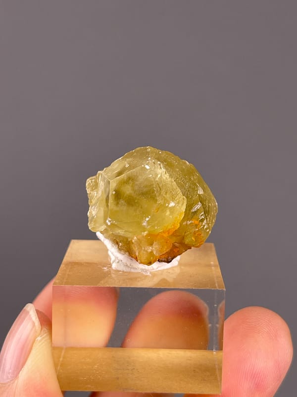 Unidentified specimen from Daye, Hubei, China: rounded front with a small orange brown lower attachment.
