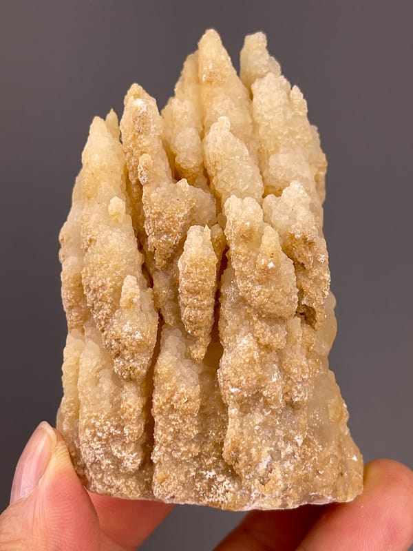 Unidentified specimen from Yunnan, China: front close view of uneven tapered growths.