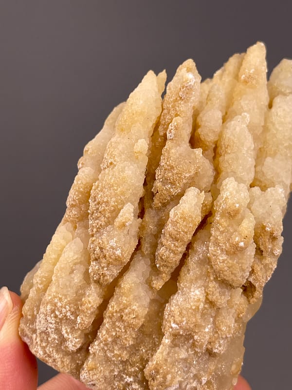 Unidentified specimen from Yunnan, China: tilted close view of long granular beige projections.