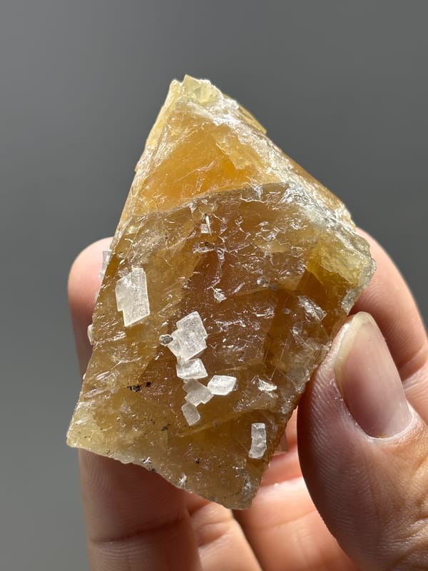 Unusual honey scheelite floater with calcite from Xuebaoding, Sichuan, China, second angle