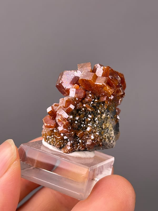 Orange-red hexagonal tabular crystals on natural vanadinite specimen from Morocco