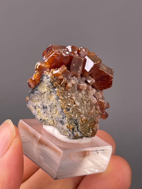 Vanadinite specimen from Morocco, characterized by orange-red hexagonal tabular crystals