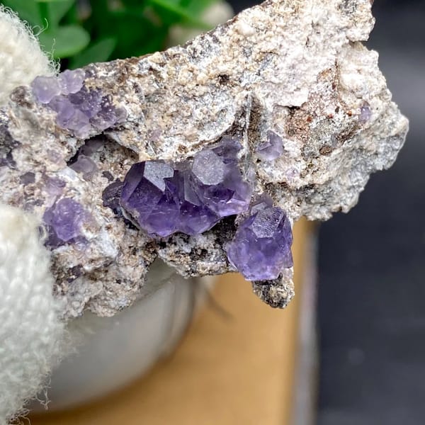 Transparent violet fluorite cubes on pale plate from Fujian, China, view 5 of 9