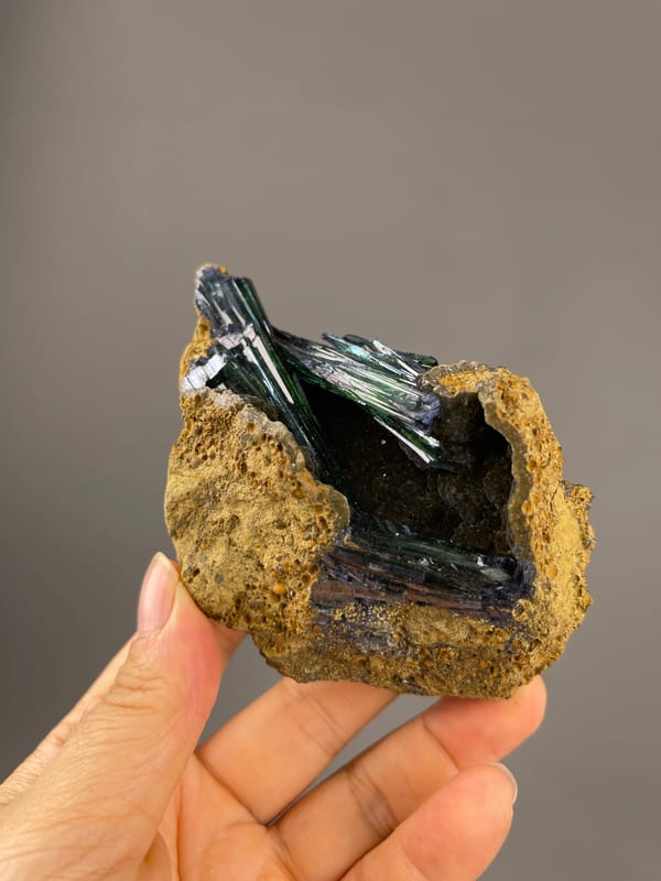 Vivianite specimen from Brazil, defined by dark green-black striated blades