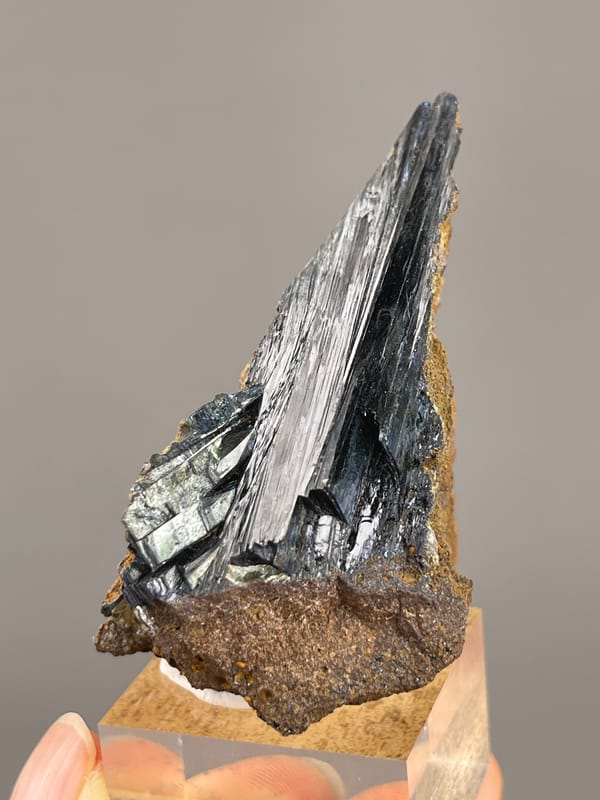 Vivianite from Brazil: oblique view of parallel reflective crystal faces.