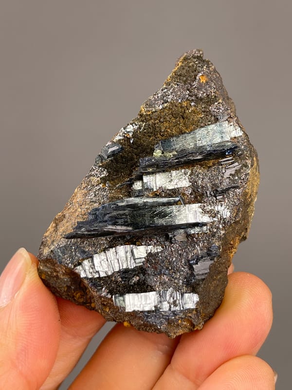 Vivianite from Brazil: broad side showing reflective elongated crystals.