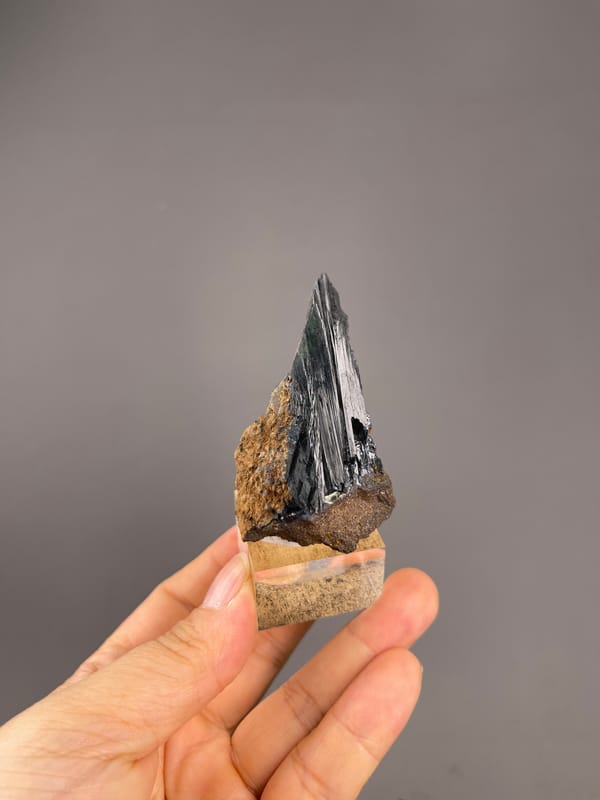 Vivianite from Brazil: full specimen showing the tall pointed outline.
