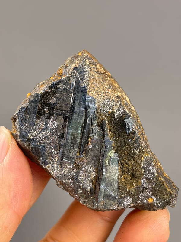 Vivianite from Brazil: triangular matrix outline with long reflective blades.
