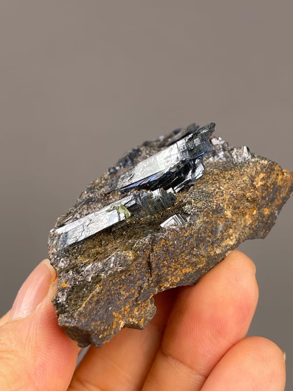 Vivianite from Brazil: low angle showing crystals projecting above matrix.