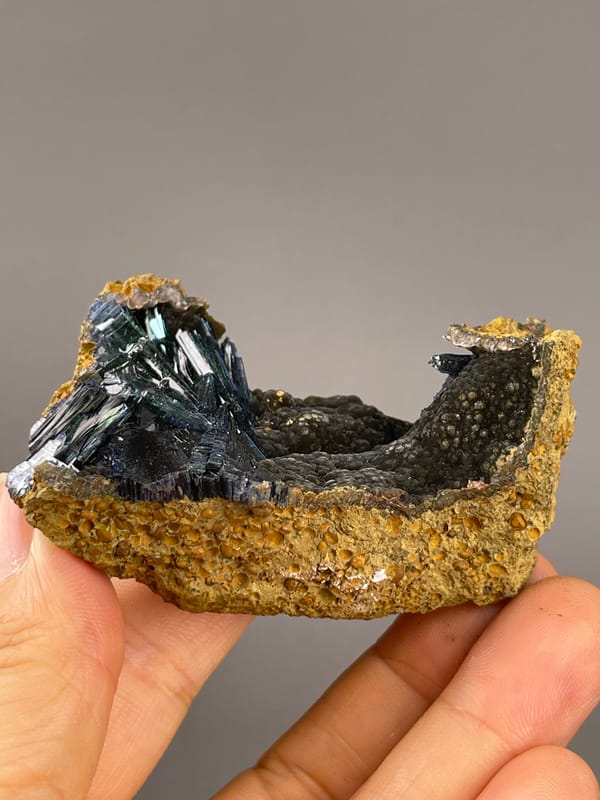 Vivianite from Brazil: low side view showing the curved matrix profile.