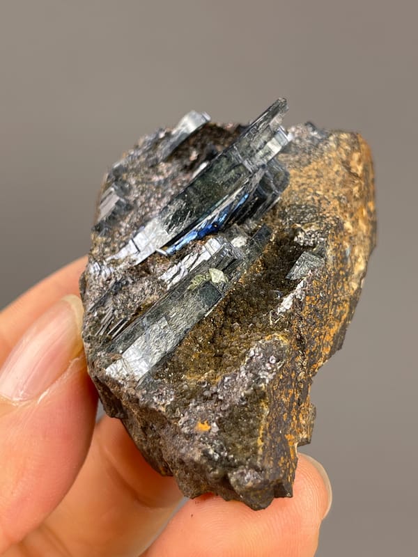 Vivianite from Brazil: upper angle showing reflective blades on matrix.
