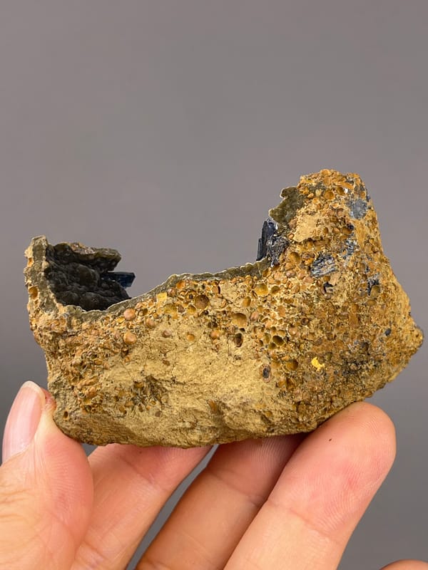 Vivianite from Brazil: rough yellow-brown underside of the matrix.