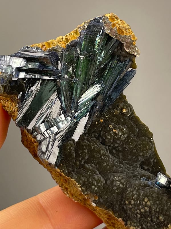 Vivianite from Brazil: close view of long reflective crystal faces.