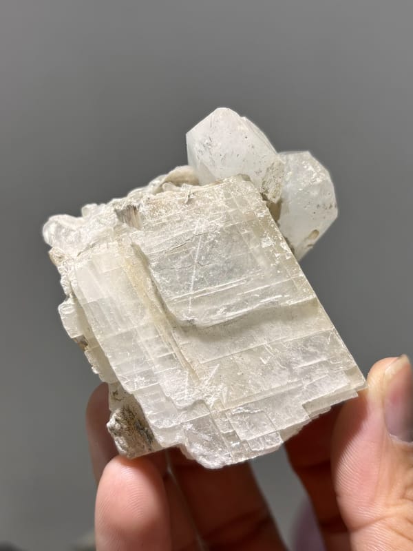 White calcite block with clear quartz crystal from Xuebaoding, Sichuan, China, second angle