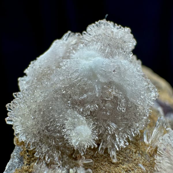 Two white chrysanthemum creedite sprays on grey rock from Guizhou, China, view 3 of 6